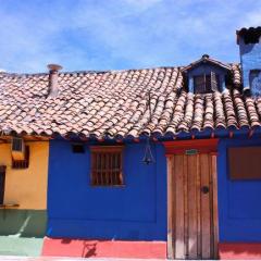 73702924 blue house in the spanish colonial neighborhood of La Candelaria, Bogota, Colombia.©Shutterstock.jpg